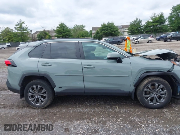 2023 Toyota RAV4 Hybrid XLE Premium z VIN 4T3B6RFV1PU120135, wystawiony jako IAAI lot #42371702 z przebiegiem 27 822 mil mil oraz . Historia ofert i sprzedaży dostępna na DreamBid. Obrazek 13.
