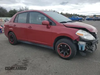 2010 Nissan Versa 1.8 S with VIN 3N1BC1AP4AL371722, listed as a Copart auction lot 72641144 with 128,445 mi miles and Salvage Title. Bid and sale history available at carsss.com. Image 4.