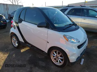 2009 Smart fortwo Pure with VIN WMEEJ31X99K292492, listed as a IAAI auction lot 41029051 with 57,741 mi miles. Bid and sale history available at carsss.com. Image 1.