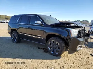 2018 GMC Yukon Denali with VIN 1GKS2CKJ3JR404177, listed as a Copart auction lot 82577354 with 129,744 mi miles and Salvage Title. Bid and sale history available at carsss.com. Image 4.