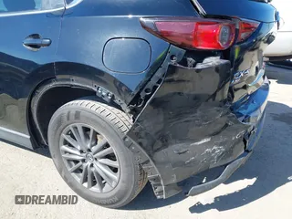 2019 Mazda CX-5 Sport with VIN JM3KFABM7K1579747, listed as a IAAI auction lot 41965097 with 151,042 mi miles and . Bid and sale history available at DreamBid. Image 12.