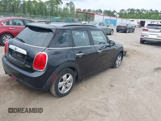 2015 MINI Hardtop 4 Door z VIN WMWXS5C58FT828427, wystawiony jako IAAI lot #42395620 z przebiegiem 102 282 mil mil oraz . Historia ofert i sprzedaży dostępna na DreamBid. Obrazek 4.