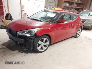 2013 Hyundai Veloster w/Gray Int with VIN KMHTC6AD2DU136990, listed as a IAAI auction lot 41363689 with 74,594 mi miles. Bid and sale history available at carsss.com. Image 2.