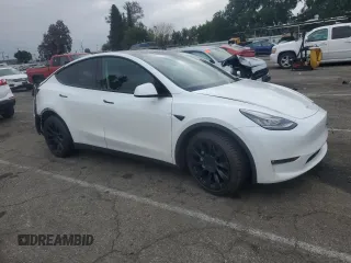 2023 Tesla Model Y Long Range with VIN 7SAYGDEE3PF583883, listed as a Copart auction lot 50920145 with 72,155 mi miles and Salvage Title. Bid and sale history available at DreamBid. Image 4.