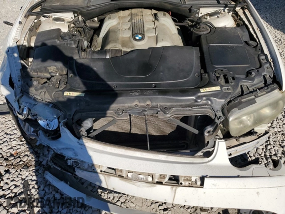 2004 BMW 7 Series 745i with VIN WBAGL63484DP68795, listed as a Copart auction lot 77201084 with 134,044 mi miles and Salvage Title. Bid and sale history available at DreamBid. Image 11.