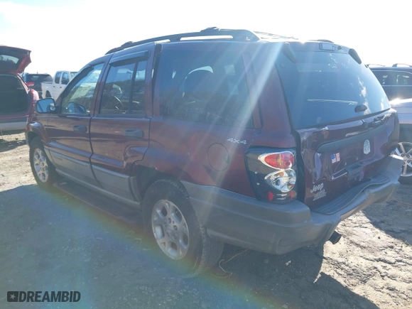 1999 Jeep Grand Cherokee Laredo with VIN 1J4GW58S5XC781472, listed as a IAAI auction lot 41738515 with 216,000 mi miles. Bid and sale history available at carsss.com. Image 3.