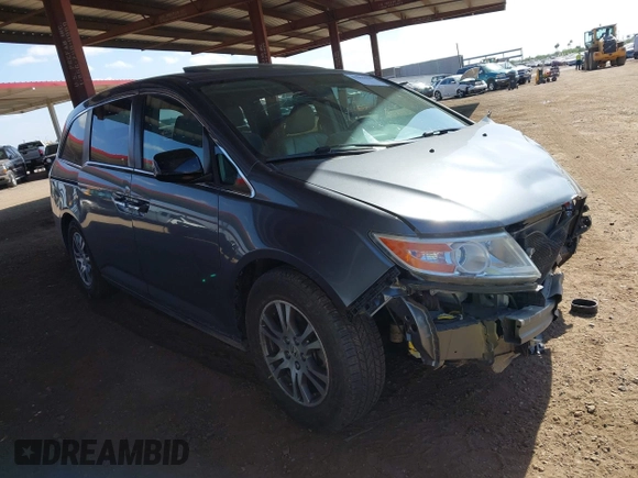 2012 Honda Odyssey EX-L with VIN 5FNRL5H6XCB103498, listed as a IAAI auction lot 42065658 with 104,933 mi miles and . Bid and sale history available at carsss.com. Image 1.