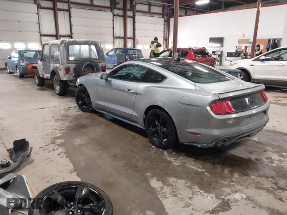 2021 Ford Mustang EcoBoost with VIN 1FA6P8TH1M5127800, listed as a IAAI auction lot 41625544 with 82,531 mi miles. Bid and sale history available at carsss.com. Image 3.