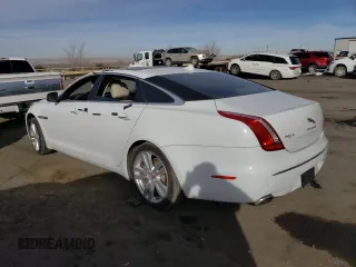 2014 Jaguar XJ with VIN SAJWA2GZ7E8V69543, listed as a Copart auction lot 86390204 with 110,929 mi miles and Salvage Title. Bid and sale history available at carsss.com. Image 2.