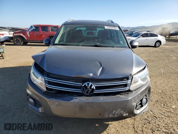 2014 Volkswagen Tiguan SEL with VIN WVGAV3AX0EW555873, listed as a Copart auction lot 55695955 with 69,984 mi miles and Salvage title. Bid and sale history available at DreamBid. Image 5.