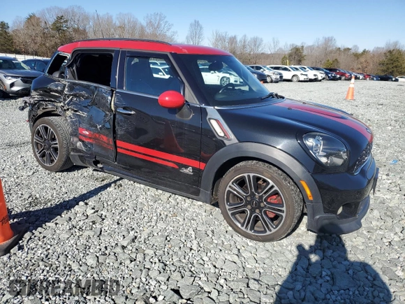 2014 MINI Countryman John Cooper Works with VIN WMWXD1C5XEWS34681, listed as a Copart auction lot 41781005 with 133,463 mi miles and Salvage Title. Bid and sale history available at DreamBid. Image 4.