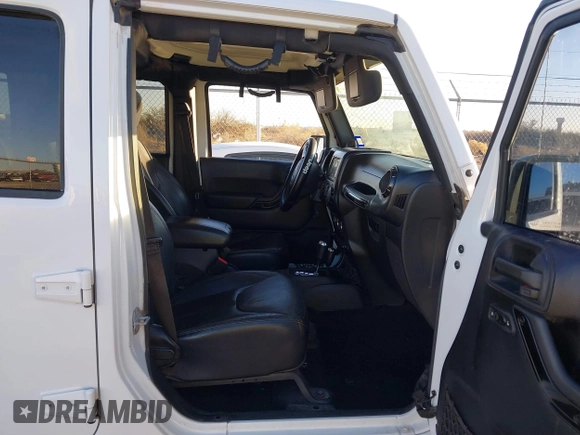 2014 Jeep Wrangler Unlimited Sahara with VIN 1C4BJWEG0EL273475, listed as a IAAI auction lot 41515425 with 128,900 mi miles. Bid and sale history available at carsss.com. Image 5.