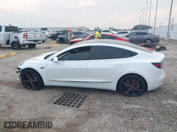 2019 Tesla Model 3 Mid Range with VIN 5YJ3E1EA8KF472540, listed as a IAAI auction lot 41661312 with 75,575 mi miles and . Bid and sale history available at DreamBid. Image 15.