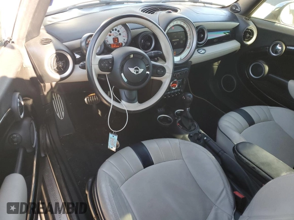 2014 MINI Convertible S with VIN WMWZP3C58ET706941, listed as a Copart auction lot 81900674 with 61,292 mi miles and Salvage title. Bid and sale history available at DreamBid. Image 8.