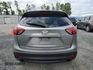 2014 Mazda CX-5 Touring z VIN JM3KE4CY0E0407169, wystawiony jako Copart lot #57877215 z przebiegiem 168 277 mil mil oraz Szkoda całkowita • Salvage title. Historia ofert i sprzedaży dostępna na DreamBid. Obrazek 6.