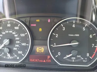 2012 BMW 1 Series 135i with VIN WBAUN7C59CVM26809, listed as a IAAI auction lot 42336904 with 164,247 mi miles and . Bid and sale history available at DreamBid. Image 7.