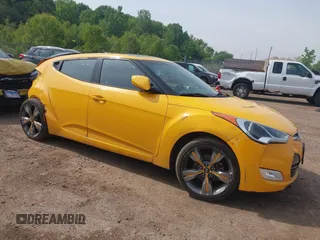 2013 Hyundai Veloster w/Black Int with VIN KMHTC6AD7DU161769, listed as a IAAI auction lot 42448221 with 139,936 mi miles and . Bid and sale history available at DreamBid. Image 1.