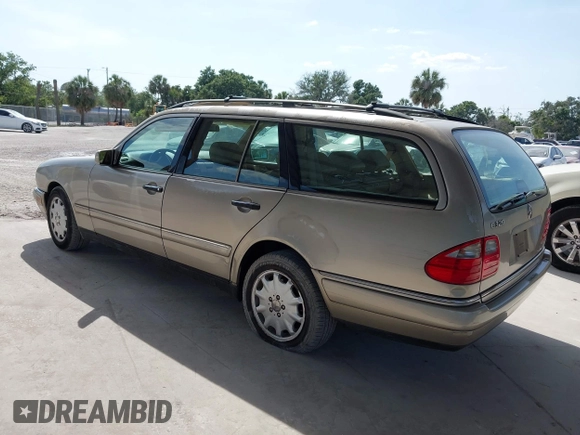 1999 Mercedes-Benz E-Class with VIN WDBJH65F3XA845635, listed as a IAAI auction lot 42102122 with 215,678 mi miles. Bid and sale history available at carsss.com. Image 3.