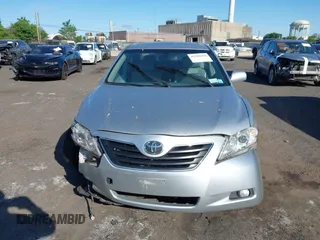 2007 Toyota Camry LE z VIN JTNBK46K473003622, wystawiony jako IAAI lot #42286264 z przebiegiem 105 630 mil mil oraz . Historia ofert i sprzedaży dostępna na DreamBid. Obrazek 13.