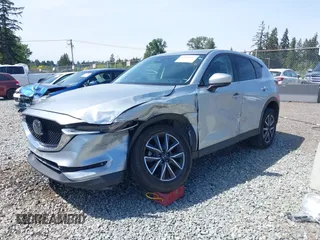 2018 Mazda CX-5 Grand Touring z VIN JM3KFADM7J0318684, wystawiony jako IAAI lot #42226937 z przebiegiem 69 166 mil mil oraz . Historia ofert i sprzedaży dostępna na DreamBid. Obrazek 2.