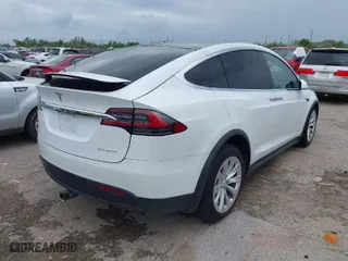 2020 Tesla Model X Long Range with VIN 5YJXCBE23LF233484, listed as a IAAI auction lot 41886062 with 1 mi miles. Bid and sale history available at carsss.com. Image 4.