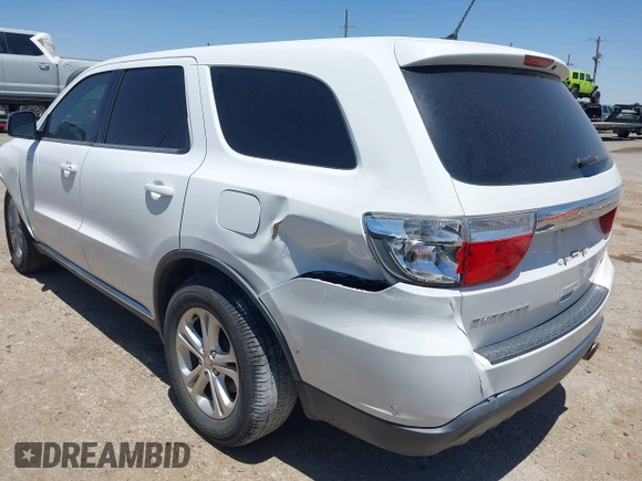 2013 Dodge Durango SXT with VIN 1C4RDHAG0DC696904, listed as a IAAI auction lot 42310831 with 112,964 mi miles and . Bid and sale history available at DreamBid. Image 3.