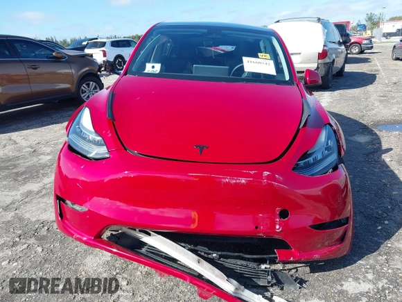 2022 Tesla Model Y Long Range z VIN 7SAYGDEE1NF385414, wystawiony jako IAAI lot #41660542 z przebiegiem 54 075 mil mil oraz . Historia ofert i sprzedaży dostępna na DreamBid. Obrazek 6.