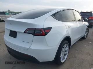 2023 Tesla Model Y Long Range with VIN 7SAYGDEE4PF770307, listed as a IAAI auction lot 42141175 with 34,901 mi miles and . Bid and sale history available at carsss.com. Image 4.