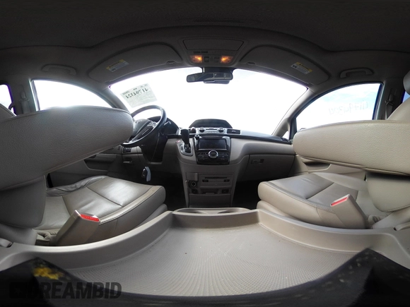 2014 Honda Odyssey Touring with VIN 5FNRL5H97EB117971, listed as a IAAI auction lot 41794324 with 198,191 mi miles and . Bid and sale history available at DreamBid. Image 18.