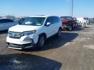 2021 Honda Pilot EX-L with VIN 5FNYF5H57MB037861, listed as a IAAI auction lot 41566924 with 42,867 mi miles. Bid and sale history available at carsss.com. Image 2.