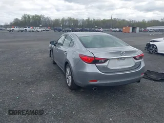 2014 Mazda 6 i Touring with VIN JM1GJ1V64E1147549, listed as a IAAI auction lot 42041025 with 124,400 mi miles and . Bid and sale history available at DreamBid. Image 3.