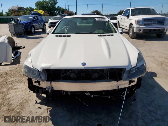 2009 Mercedes-Benz SL 550 with VIN WDBSK71F69F147589, listed as a Copart auction lot 65976995 with 77,387 mi miles and Salvage title. Bid and sale history available at DreamBid. Image 5.
