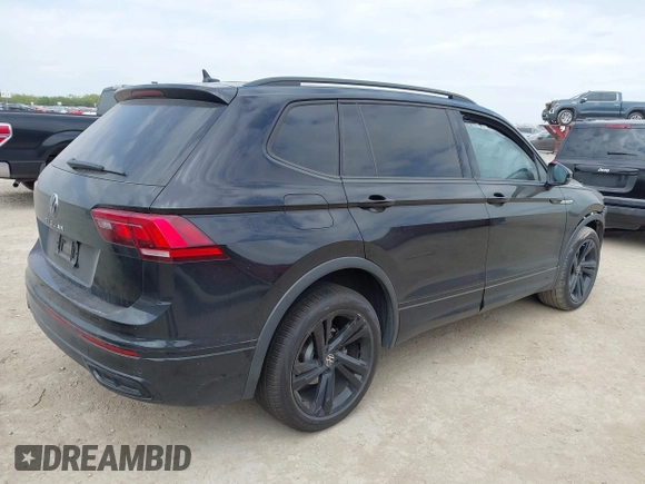 2023 Volkswagen Tiguan SE R-Line Black with VIN 3VVCB7AX0PM122636, listed as a IAAI auction lot 42040494 with 8,589 mi miles and . Bid and sale history available at DreamBid. Image 4.