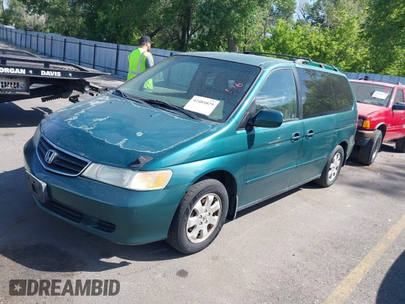 2002 Honda Odyssey EX z VIN 2HKRL18632H582789, wystawiony jako IAAI lot #42481029 z przebiegiem 272 380 mil mil oraz . Historia ofert i sprzedaży dostępna na DreamBid. Obrazek 2.