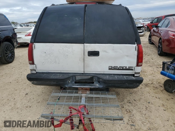 1999 Chevrolet Suburban with VIN 1GNEC16R7XJ418169, listed as a Copart auction lot 88995495 with 2,015,240 mi miles and Salvage title. Bid and sale history available at DreamBid. Image 6.