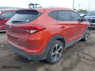 2016 Hyundai Tucson Sport with VIN KM8J33A26GU056164, listed as a IAAI auction lot 41469160 with 136,301 mi miles. Bid and sale history available at carsss.com. Image 4.