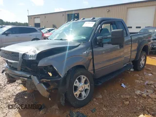 2009 Ford F-150 STX with VIN 1FTRX14809KC94736, listed as a IAAI auction lot 41721775 with 141,875 mi miles. Bid and sale history available at carsss.com. Image 2.