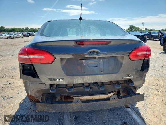 2016 Ford Focus SE with VIN 1FADP3F28GL321967, listed as a Copart auction lot 59556735 with 72,684 mi miles and Salvage title. Bid and sale history available at DreamBid. Image 6.
