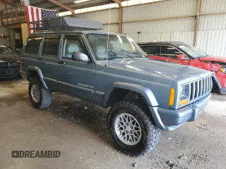 1998 Jeep Cherokee Country with VIN 1J4FT78S8WL252502, listed as a Copart auction lot 59664545 with 133,148 mi miles and Salvage title. Bid and sale history available at DreamBid. Image 4.