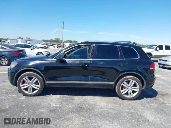 2013 Volkswagen Touareg Lux with VIN WVGEF9BP6DD004454, listed as a IAAI auction lot 41862958 with 239,548 mi miles and . Bid and sale history available at DreamBid. Image 14.