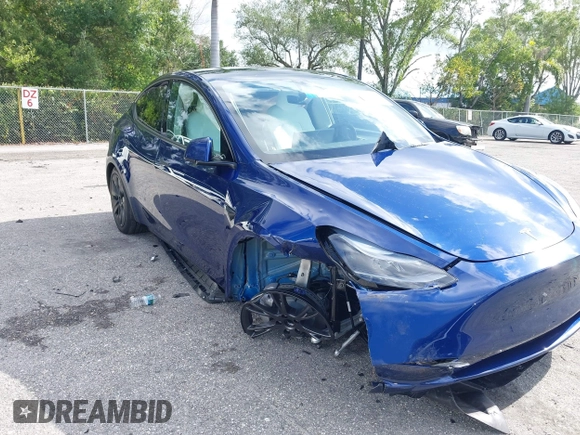 2025 Tesla Model Y Long Range z VIN 7SAYGDED0SF256650, wystawiony jako IAAI lot #41993206 z przebiegiem Nie podano mil oraz . Historia ofert i sprzedaży dostępna na DreamBid. Obrazek 6.