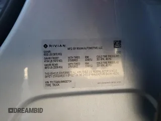 2022 Rivian R1T Launch Edition z VIN 7FCTGAAL6NN002704, wystawiony jako Copart lot #77913144 z przebiegiem 40 665 mil mil oraz Szkody całkowita. Historia ofert i sprzedaży dostępna na DreamBid. Obrazek 12.