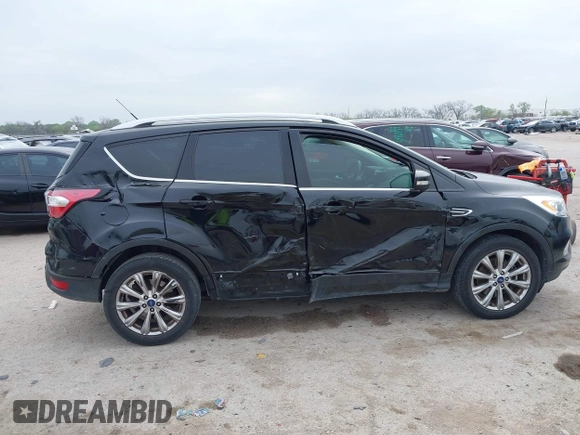 2017 Ford Escape Titanium with VIN 1FMCU0J93HUF10664, listed as a IAAI auction lot 41921588 with 88,377 mi miles. Bid and sale history available at carsss.com. Image 6.