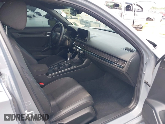 2025 Honda Civic Sport with VIN 2HGFE2F54SH564003, listed as a IAAI auction lot 42123436 with 7,042 mi miles and . Bid and sale history available at DreamBid. Image 5.