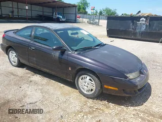 2000 Saturn SC with VIN 1G8ZR1275YZ113537, listed as a IAAI auction lot 42073307 with 276,289 mi miles. Bid and sale history available at carsss.com. Image 1.