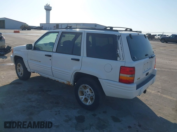 1997 Jeep Grand Cherokee Limited with VIN 1J4GZ78Y8VC769675, listed as a IAAI auction lot 41694347 with 113,834 mi miles. Bid and sale history available at carsss.com. Image 3.