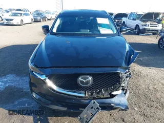 2020 Mazda CX-5 Grand Touring with VIN JM3KFBDM0L0790508, listed as a IAAI auction lot 41883319 with 114,398 mi miles and . Bid and sale history available at carsss.com. Image 12.