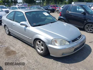 1999 Honda Civic EX z VIN 1HGEJ8148XL016511, wystawiony jako IAAI lot #42409856 z przebiegiem 245 987 mil mil oraz . Historia ofert i sprzedaży dostępna na DreamBid. Obrazek 1.