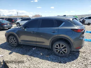 2018 Mazda CX-5 Touring z VIN JM3KFACM5J0338126, wystawiony jako Copart lot #56185795 z przebiegiem 115 254 mil mil oraz Szkoda całkowita • Salvage title. Historia ofert i sprzedaży dostępna na DreamBid. Obrazek 2.