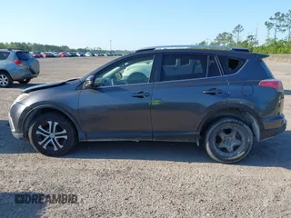 2016 Toyota RAV4 LE with VIN JTMZFREV7GJ065267, listed as a IAAI auction lot 42011267 with 180,127 mi miles. Bid and sale history available at carsss.com. Image 14.